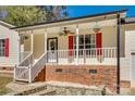 Inviting front porch with red shutters and landscaping at 3110 Bush Rd, Clover, SC 29710