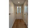 Light and bright entryway with hardwood floors and white walls at 7201 Winery Ln, Charlotte, NC 28227
