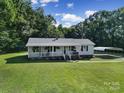 Aerial view of a cozy ranch home with a carport and large yard at 1020 Saint Paul Church Rd, Clover, SC 29710