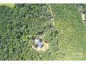 Home surrounded by lush forest and trees at 14941 Deer Hollow Dr, Gold Hill, NC 28071