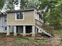 Rear view of a house with a wooden deck and stairs at 2102 Twin Ave, Gastonia, NC 28052