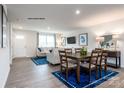 Open dining area with hardwood floors and view of living room at 165 Basildon St # 1011, Lancaster, SC 29720