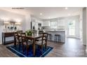 Kitchen with island, hardwood floors and dining area at 165 Basildon St # 1011, Lancaster, SC 29720