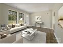 Bright living room with light colored sofa and coffee table at 333 Irwin St, Rock Hill, SC 29730