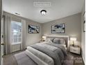 Virtually staged bedroom with window and closet at 3309 Paxton Ridge Dr, Indian Trail, NC 28079