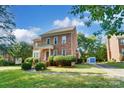 Beautiful brick home with landscaping and a paved walkway at 6517 Hunter Pine Ln, Charlotte, NC 28270