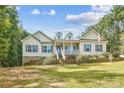 Ranch home with light beige vinyl siding and a large yard at 531 Tributary Dr # 26, Fort Lawn, SC 29714