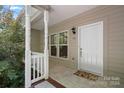 Front porch with white railing and door at 116 Par Pl, Mooresville, NC 28115