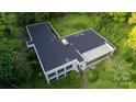 An aerial shot of a modern home with a flat roof at 9224 Maggie Robinson Rd, Waxhaw, NC 28173