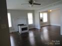 Living room features hardwood floors, fireplace and built-in shelving at 1146 Buffalo St, Shelby, NC 28150