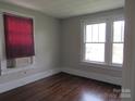 Bright bedroom with hardwood floors, window, and window blinds at 1146 Buffalo St, Shelby, NC 28150