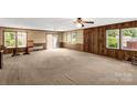 Bright living room with wood paneling and access to outdoor space at 2017 And 2025 Filbert Hwy, York, SC 29745