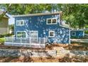 Newly renovated blue house with deck and stone retaining wall at 50444 Haven Bend Rd, Albemarle, NC 28001