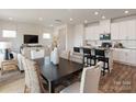 Open concept dining area with kitchen and living room views at 161 Shepherds Landing Dr, Mooresville, NC 28115