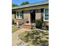 Brick ranch home with a landscaped front yard and walkway at 836 S Cherry Rd, Rock Hill, SC 29732