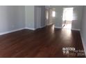 Spacious living room with hardwood floors at 7118 Quail Meadow Ln, Charlotte, NC 28210