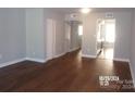 Living room with hardwood floors and neutral walls at 7118 Quail Meadow Ln, Charlotte, NC 28210