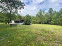 Mobile home on a grassy lot near woods at 6134 Shirley Rd, Fort Lawn, SC 29714