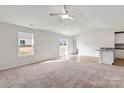 Bright living room featuring hardwood floors and access to back patio at 146 Adams Tree Way, Troutman, NC 28166