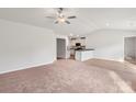 Open living room with high ceilings and kitchen access at 217 Colonial Reserve Ave, Troutman, NC 28166