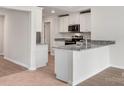 Modern kitchen with granite countertops and stainless steel appliances at 217 Colonial Reserve Ave, Troutman, NC 28166