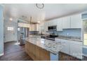 Modern kitchen with stainless steel appliances and granite countertops at 4438 Old Davis Rd, Norwood, NC 28128