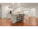 Spacious kitchen with island, granite countertops, and stainless steel appliances at 1410 Tranquility Blvd, Lancaster, SC 29720