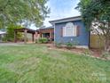 Blue house with a covered porch and landscaped yard at 1019 Valley St, Kannapolis, NC 28081