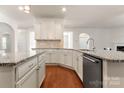 Modern kitchen with granite countertops, white cabinets, and hardwood floors at 1410 Tranquility Blvd, Lancaster, SC 29720