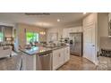 Kitchen with white cabinets, granite countertops, and stainless steel appliances at 244 Giant Oak Ave, Statesville, NC 28677