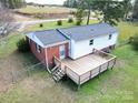 Elevated deck in backyard with stairs and railings at 2146 Nc 742 S Hwy # 7, Wadesboro, NC 28170