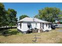 Small house with side yard and grill at 110 Sims Pkwy, Harrisburg, NC 28075
