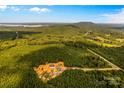 Aerial view of secluded property with a home nearby lake at 2710 Wyatt Grove Church Rd, Richfield, NC 28137