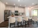 Eat-in kitchen with granite island and stainless steel appliances at 1005 Freeman View Dr, Albemarle, NC 28001