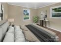 Bedroom with a bed, nightstand, and hardwood floors at 1525 Vanderlip Dr, Gastonia, NC 28052