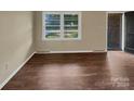 Living room with hardwood floors and large windows at 1525 Vanderlip Dr, Gastonia, NC 28052
