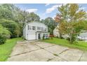 Two-story house with gray siding, a black door, and a two-car garage at 672 Carybrook Ct, York, SC 29745