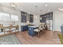 Modern kitchen with dark blue cabinets and a large island at 3016 Endhaven Terraces Ln # 11, Charlotte, NC 28277