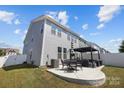 Backyard patio with modern pergola and comfortable seating area at 320 Embers Ln, Clover, SC 29710