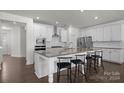 Bright kitchen with white cabinets, granite countertops, and stainless steel appliances at 320 Embers Ln, Clover, SC 29710