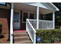 Covered front porch with white railing and steps at 500 Doffin Ln, Gastonia, NC 28052