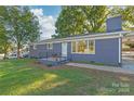 Ranch style home with gray exterior and brick walkway at 335 Davidson Hwy, Concord, NC 28027