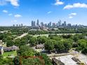 Aerial view of property with city skyline in the background at 225 Flint St, Charlotte, NC 28216