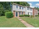 Two story townhome with brick and siding at 9440 Lexington Cir, Charlotte, NC 28213