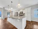 Kitchen with white cabinets, granite countertops, and island at 24601 Blue Heron Cir, Lancaster, SC 29720