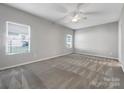 Primary bedroom with ceiling fan and neutral decor at 24601 Blue Heron Cir, Lancaster, SC 29720