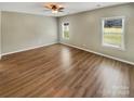 Spacious bedroom with hardwood floors and large windows at 6611 Buck Horn Pl, Waxhaw, NC 28173