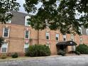 Brick building exterior with landscaping and parking at 300 N Fulton St # 11, Salisbury, NC 28144