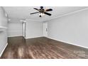 Bright living room with hardwood floors and ceiling fan at 4754 Hedgemore Dr # T, Charlotte, NC 28209