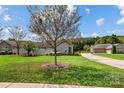 Stone and siding exterior with lush landscaping and private backyard at 4759 Polo Gate Blvd, Charlotte, NC 28216